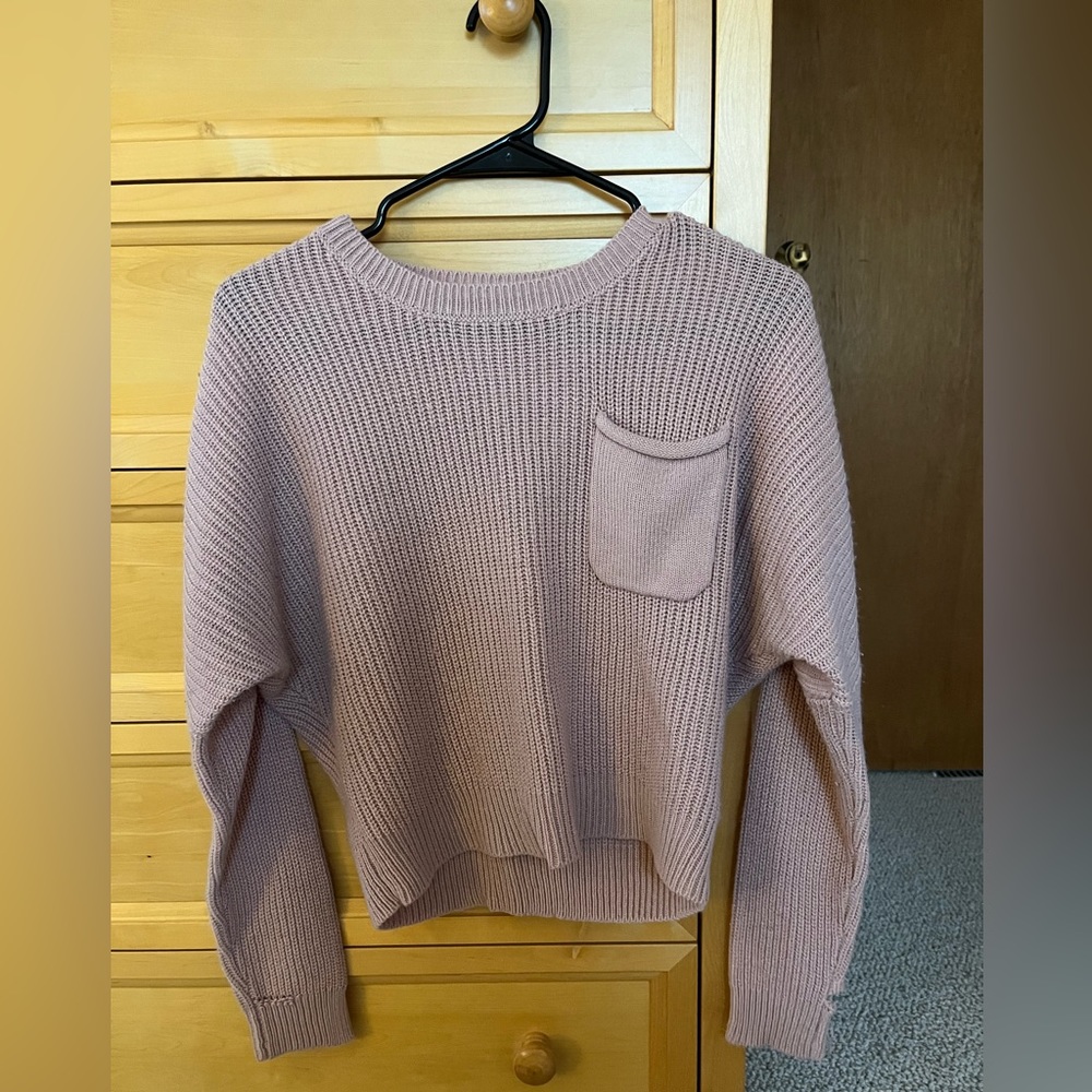Rusty pink sweater with pocket, small rip in the sleeve
